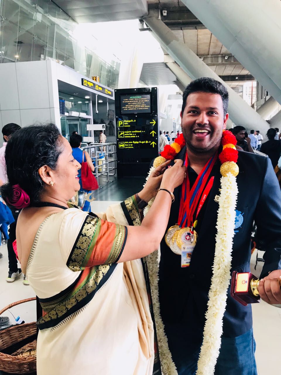 Rtr. Tarun Murugesh being honoured with a garland and medals