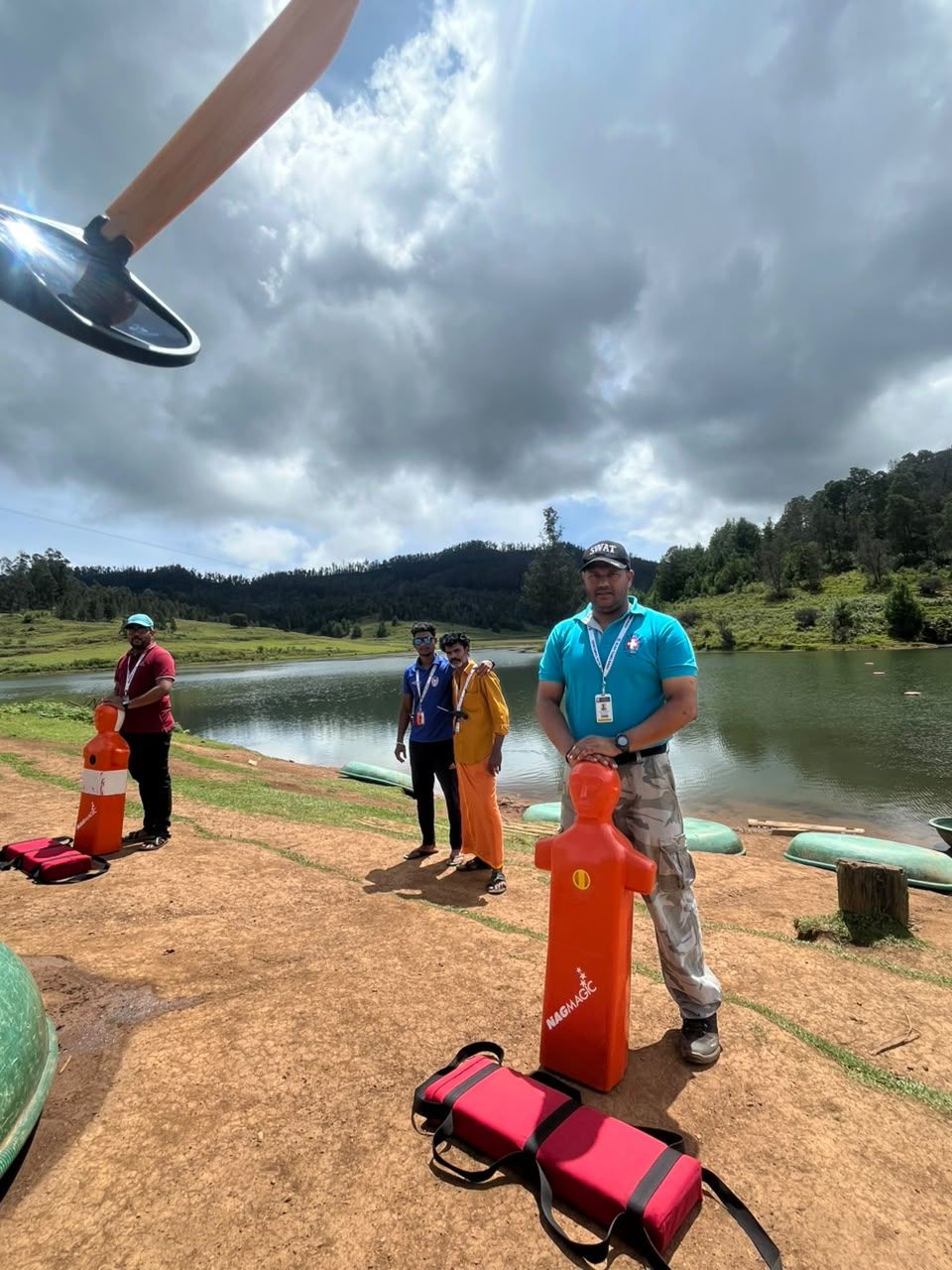 Rescue tubes and equipment beside a lake