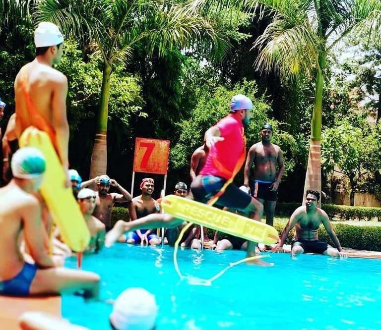 Lifeguard trainees practising with a rescue tube