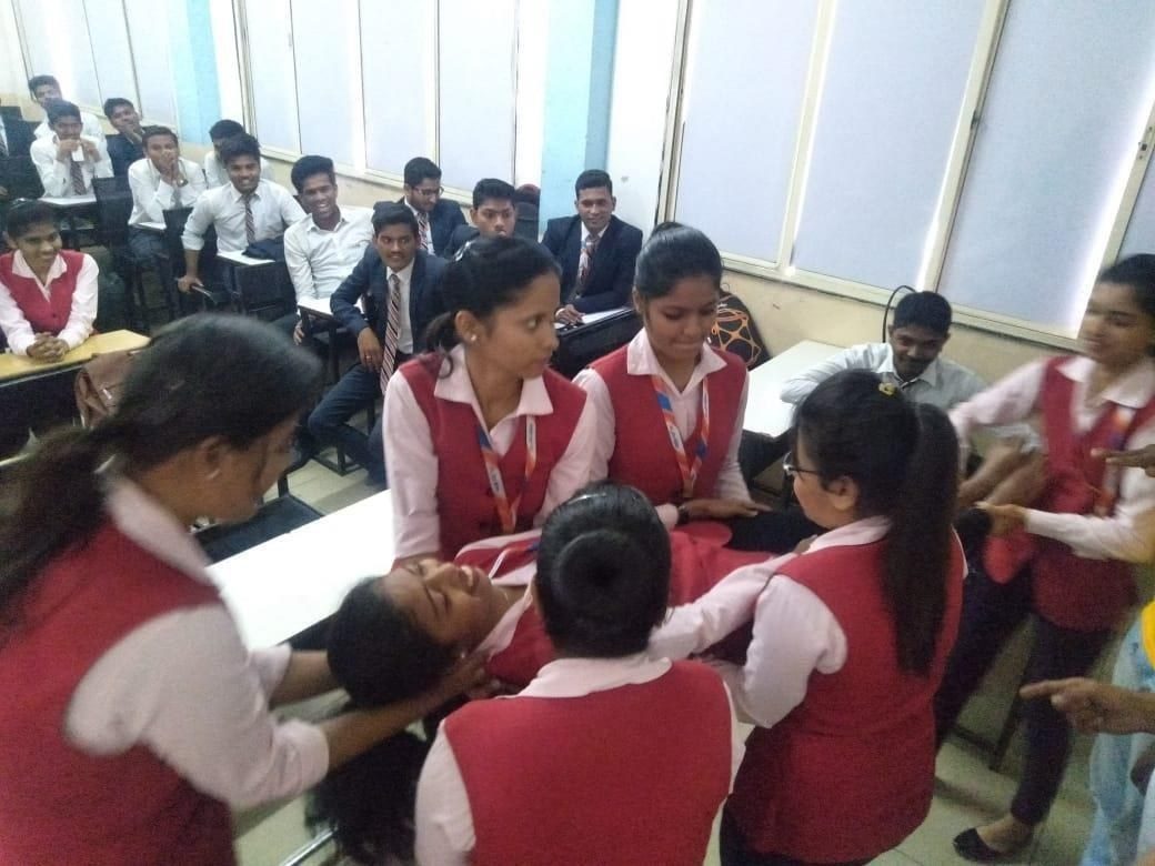 College students practising a casualty carry